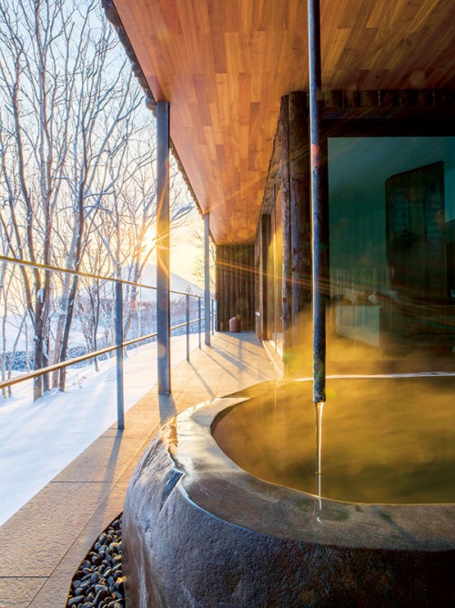 An outdoor hot spring bath at Zaborin, an exclusive new ryokan in Niseko (Credit: Shouya Grigg)